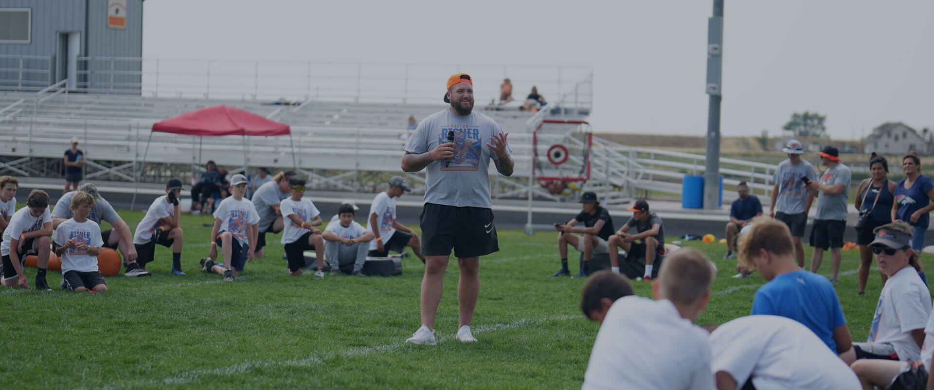 Dalton Risner teaching football at the WIggins, CO Youth Camp